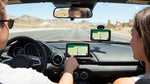 Illuminated dashboard GPS screen inside a car rental navigating the Las Vegas streets