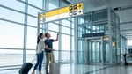 Traveler with luggage arriving at an airport car rental counter in New York