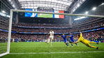 France forward takes a shot on goal against Italy as the goalkeeper dives at NRG Stadium in Houston. FIFA World Cup 2026.