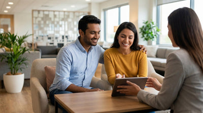 A diverse couple smiles with relief while reviewing clear, all-inclusive pricing options for their car hire.