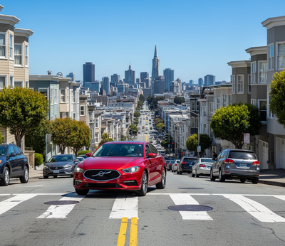 A modern red sedan driving down a bustling Lombard Street, San Francisco.