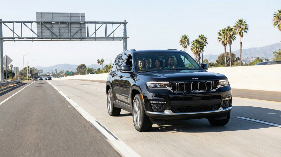 Friends in a black Jeep Grand Cherokee rental car using a marked express lane on a sunny Los Angeles highway.