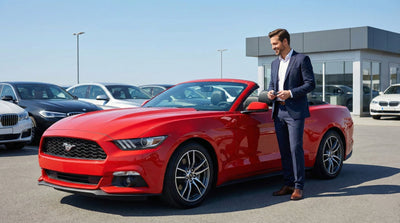 A family with luggage waits in line at a busy, well-lit car rental agency counter, indicating high demand.