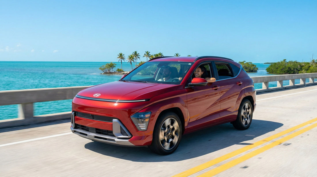 A red Hyundai Kona driving across a long bridge over turquoise water on a sunny day heading towards Key West.