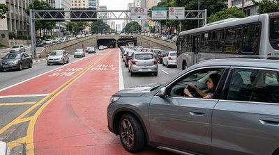 A car hire approaching the Lincoln Tunnel entrance during heavy New York City rush hour traffic
