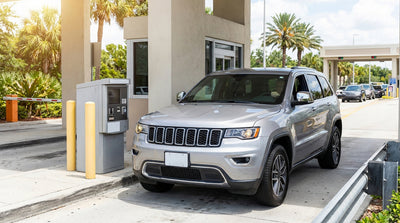 A car hire drives towards the toll booths of the large multi-story parking garage at Universal Orlando