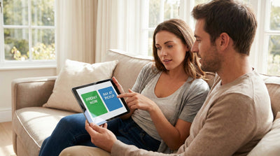 A couple comparing prepay and pay-at-pickup car rental options on a tablet while planning their trip.