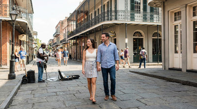 Couple walking through the French Quarter in New Orleans considering if a car rental is needed.