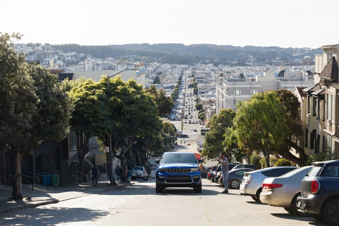 Modern SUV on a steep San Francisco street, with city skyline in background, perfect for car hire and car rental.